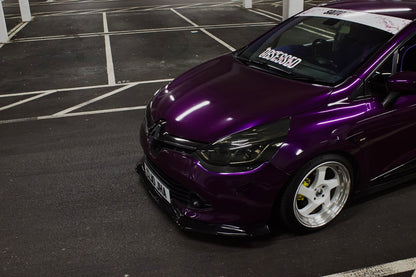 Purple Renault Clio displaying a white Obsessed cherry blossom windscreen banner