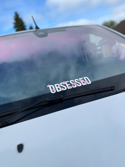 White Obsessed Cherry Blossom Decal fitted to the front windscreen of a white car