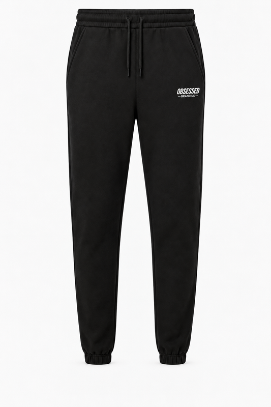 Black OBSESSED embroidered joggers with white logo and gathered ankle cuffs