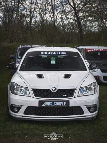 Front view of white Skoda with @VRS_COUPLE show plate