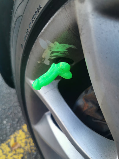 Bright green 3D printed novelty tyre valve cap fitted to an alloy wheel