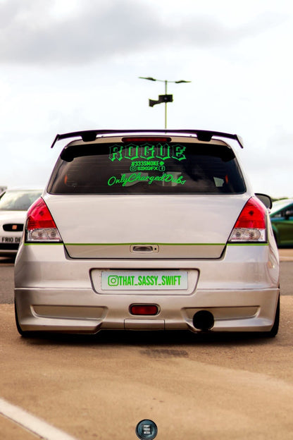 Silver Suzuki Swift with green @THAT.SASSY.SWIFT rear show plate